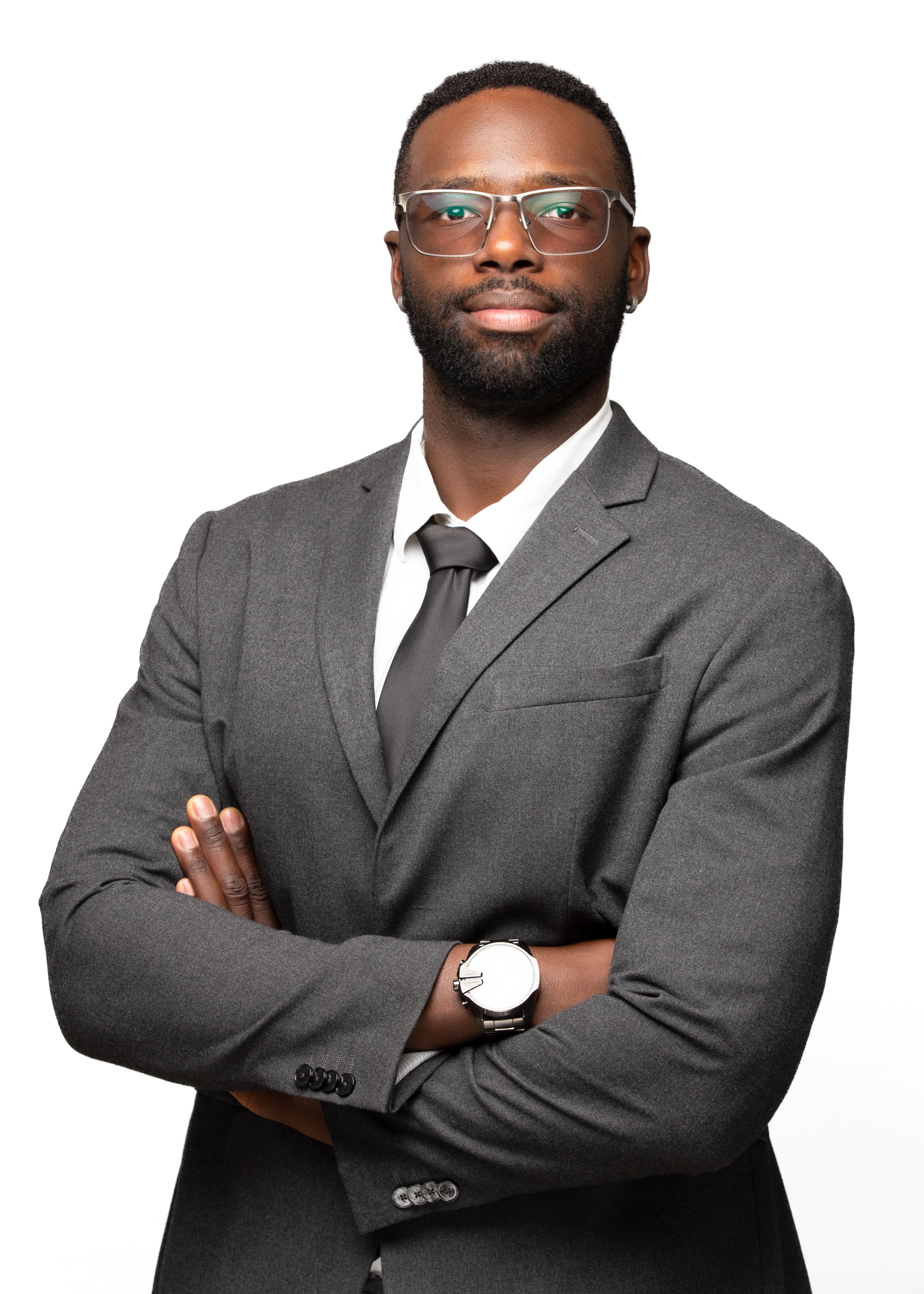 David Junior Mugo, founder of Digital Macro Sphere, in a dark jacket and white shirt against a plain light background.
